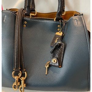 SOLD…..Coach 1st Generation Rogue Mineral